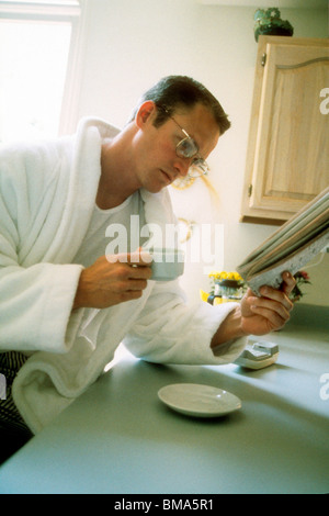 Man reading morning newspaper. Stock Photo