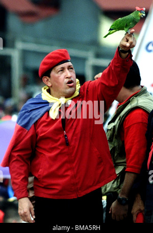 Venezuela's President Hugo Chavez holds up a parrot wearing his iconic red beret at a political rally in Caracas, Venezuela Stock Photo