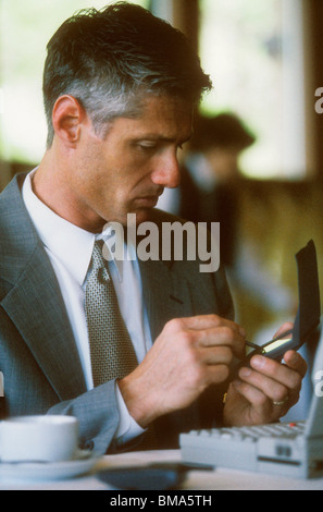 Business man using wireless mobile technology. Stock Photo