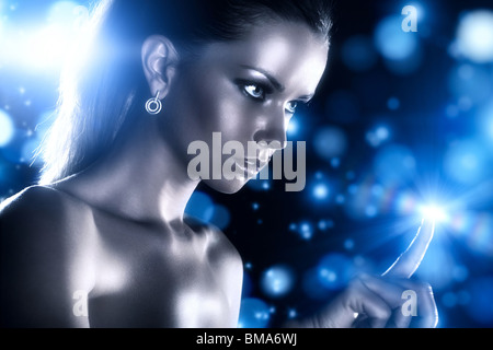 Young woman studio fashion portrait with blue stars. Stock Photo