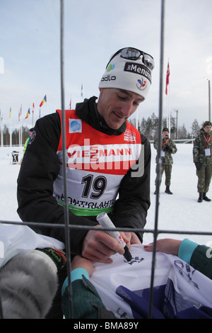 Olympic Champion Vincent Jay France signs autographs IBU World Cup Biathlon Kontiolahti Finland March 13 2010 Photo: ROB WATKINS Stock Photo