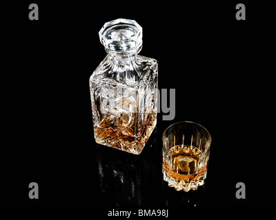 Whiskey in glass and decanter Stock Photo
