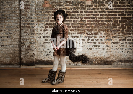 Young girl dressed up as cat Stock Photo