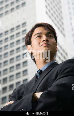 Businessman in front of High Rise Building Stock Photo