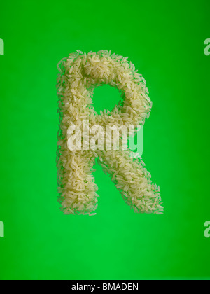 word basmati with raw rice grains on textured black surface background ...