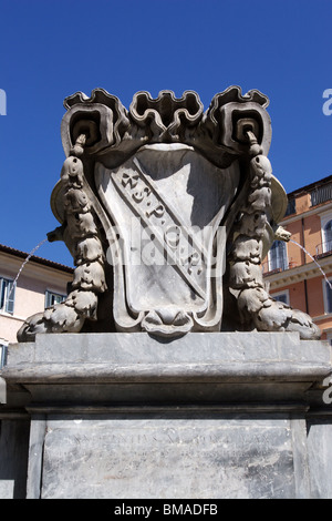 SPQR Latin inscription in marble stone on fountain in Santa Maria in Trastevere square in Rome Italy Stock Photo
