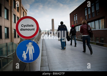 Close-up of cycling and pedestrian signs on the Millennium Bridge, London, England. Stock Photo