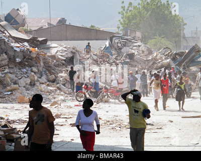 People walk through the ruined center of Port au Prince after the Haiti earthquake Stock Photo