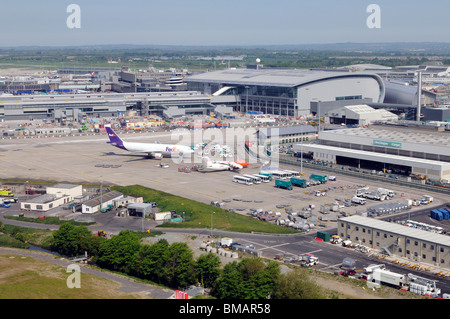 Dublin International Airport terminals and aircraft stands seen in the cargo area across the apron. Ireland Dublin Stock Photo