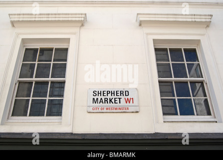 street name sign for shepherd market, mayfair, london, england, between two windows on an eighteenth century building Stock Photo