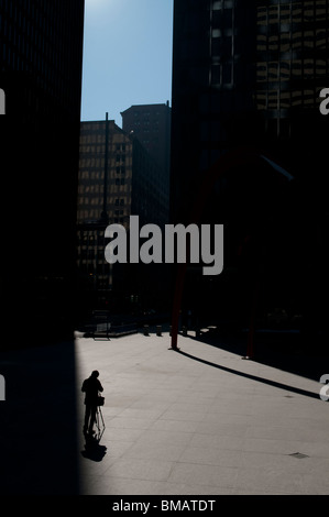 A photographer takes pictures in Chicago's Federal Plaza in downtown Chicago’s Loop on Sunday, Feb. 14, 2010. Stock Photo