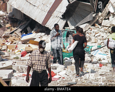 People walk through the center of Port au Prince after the Haiti earthquake Stock Photo
