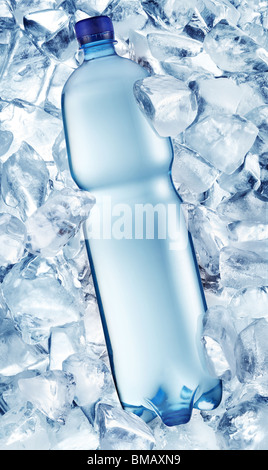 Bottle of water in ice cubes Stock Photo