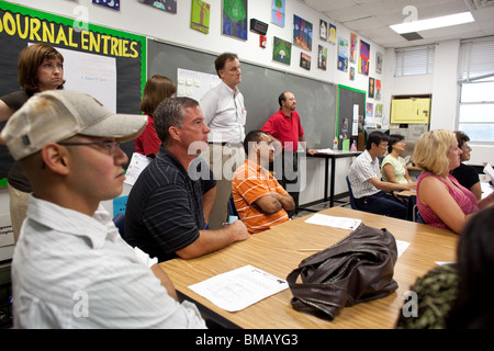 Parents of middle school students listen to a teacher during back-to-school night at Kealing Middle School in Austin, Texas. Stock Photo