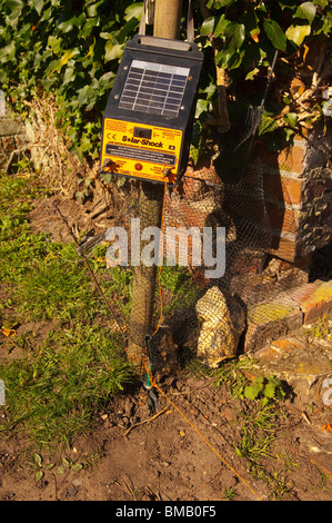 A solar powered or battery operated electric fence controller in the Uk Stock Photo