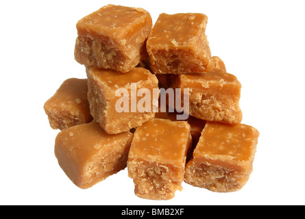 A pile of sweet butter fudge pieces isolated over white. Stock Photo