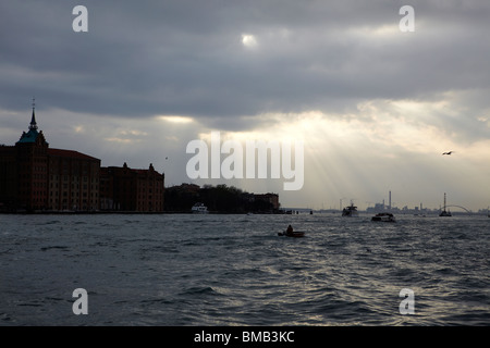 Light breaking through the clouds in Venice, Italy Stock Photo