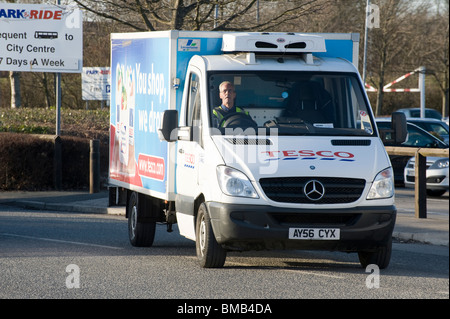 Tesco van delivering shopping in a city centre in England Stock Photo