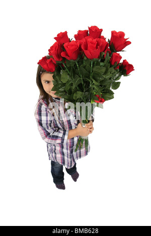 little girl hiding behind a bunch of red roses Stock Photo