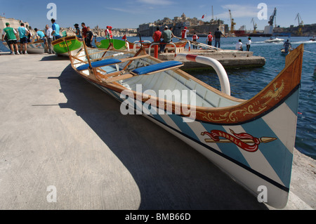 A traditional Maltese Fregatina during a Freedom day race in the Grand Harbour Malta Stock Photo