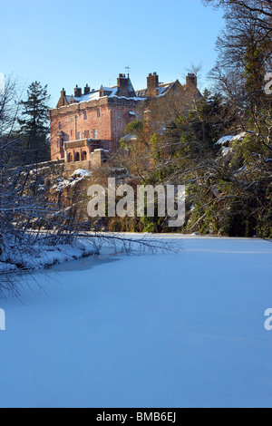 Sorn Castle with the River Ayr frozen over in winter 2010. The castle dates from the 14th Century. Stock Photo