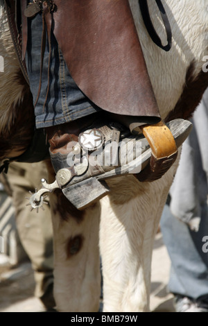 detail of cowboy sitting on horse back Stock Photo