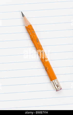 Biting Pencil and striped paper Stock Photo
