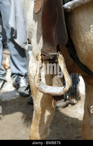 detail of cowboy sitting on horse back Stock Photo