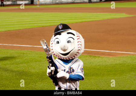 Mascot Mr. Mets at the MLB baseball game with a t-shirt gun at Citi Field Park stadium in New York. Stock Photo