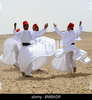 Whirling Dervishes performing at the pyramids of giza, Necropolis bordering what is now El Giza, cairo , egypt Stock Photo