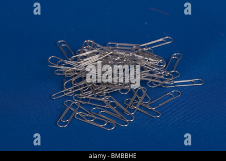 paper clips on blue background Stock Photo