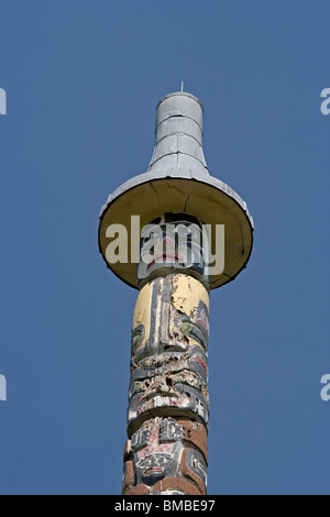 Totem pole in Windsor Great Park, UK.  Craved by men from the Kwakiutl in Canada. Stock Photo