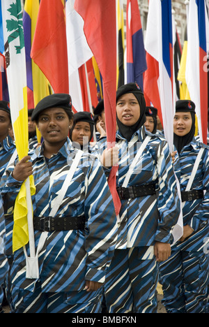 A group of young performers stand proudly during the rehearsal for the National Day Celebrations, Kuala Lumpur, Malaysia Stock Photo