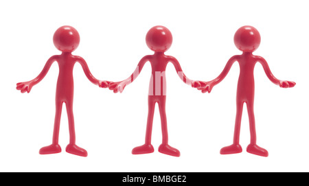 Miniature Rubber Figures Holding Hands Stock Photo