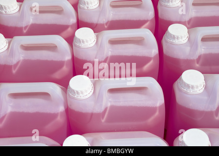 Plastic bottles of pink  screen wash. Stock Photo