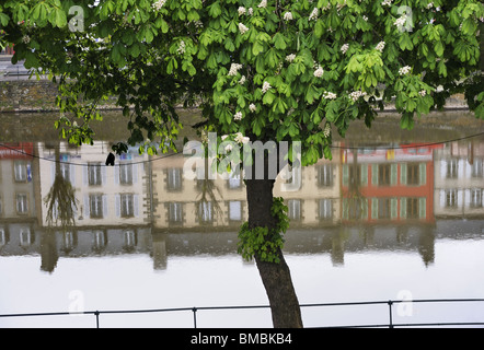 The centre of the town of Chateaulin, Brittany, France, with buildings reflected in the River Aulne Stock Photo