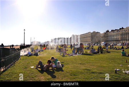 Crowds enjoying barbecues on Hove Lawns on a hot summers day Brighton UK Stock Photo