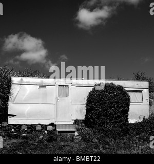 Old trailer isolated in the countryside. Stock Photo