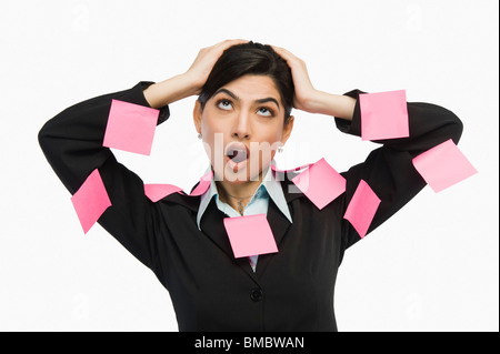 Adhesive notes on businesswoman's dress Stock Photo