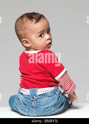 Portrait of a cute little child. Nine months old baby girl. Stock Photo