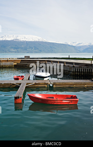 Small Harbour in Sognefjord in Balestrand near Kviknes Hotel Sogn Norway with re and white boats Stock Photo