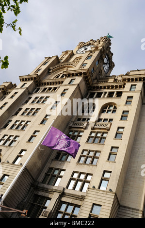 Royal Liver Assurance flag flying in front of the Liver Building, one of the three Graces at Pier Head on the banks of the River Stock Photo