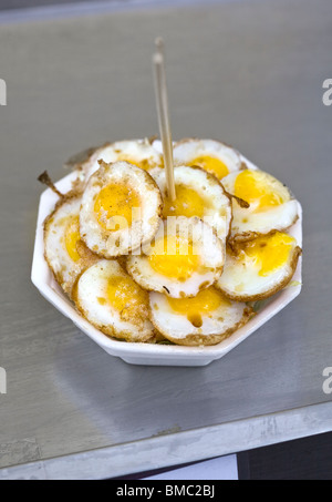 Fried Quails Eggs on sale at Chatuchak Market Bangkok Stock Photo