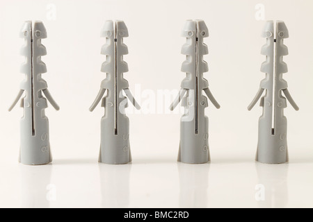 four standing rawlplugs on white background Stock Photo