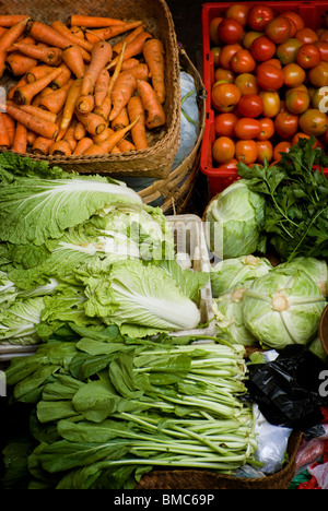 At the Ubud public market in Ubud, Bali, women come very early in the morning to go shopping for fruits, meat and vegetables. Stock Photo