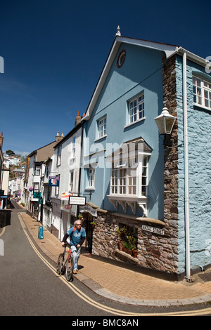 UK, England, Devon, Dartmouth, Anzac Street, man pushing bike in historic narrow old street Stock Photo