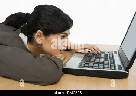 Businesswoman using a laptop Stock Photo