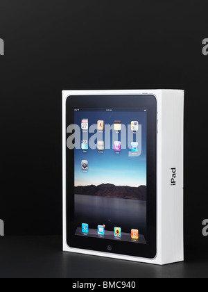 Apple iPad product packaging boxed and wrapped in plastic. Isolated on black background. Stock Photo