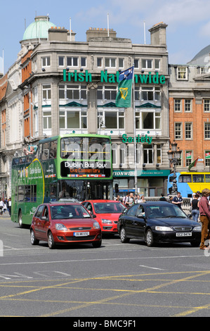 Open top double decker Dublin bus tour vehicle in traffic on O'Connell Street city centre Dublin Ireland Stock Photo