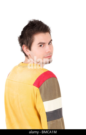 Rear view portrait of young man looking at camera, studio shot Stock Photo